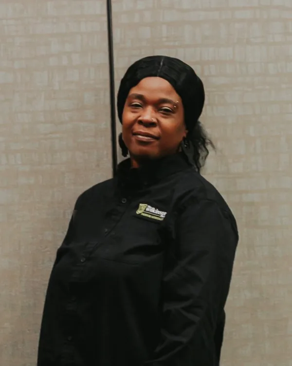 A TWF hospitality team member in the TWF jacket